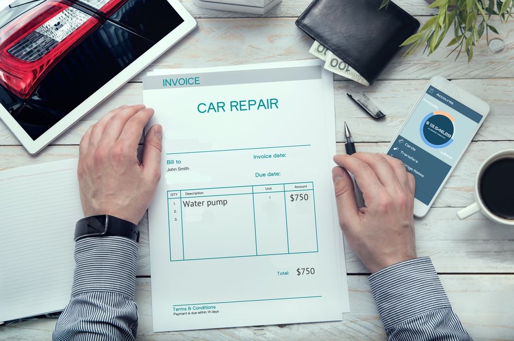 Frustrated customer looking at car bill