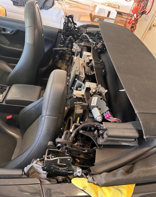 Mechanic working on convertible