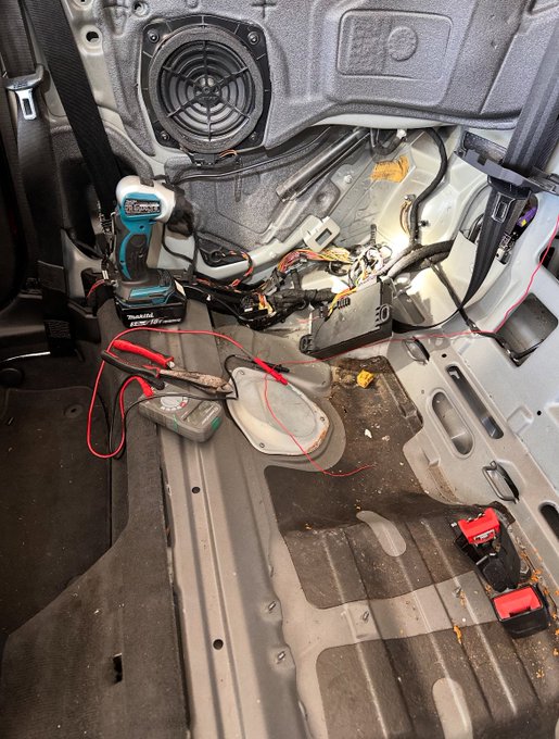 Technician working on convertible mechanism